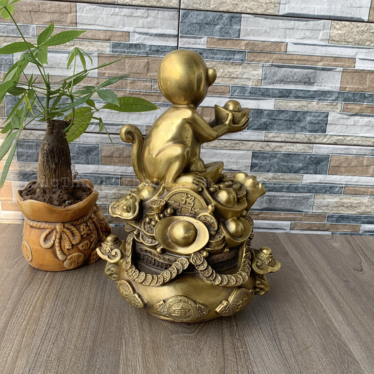 Tượng khỉ chầu hũ vàng bằng đồng